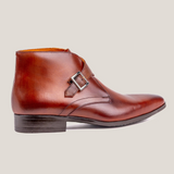 Reinhard Frans Stockholm cognac brown leather monk strap boots with silver buckle detail.