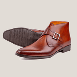 Reinhard Frans Stockholm cognac brown leather monk strap boots with silver buckle detail.